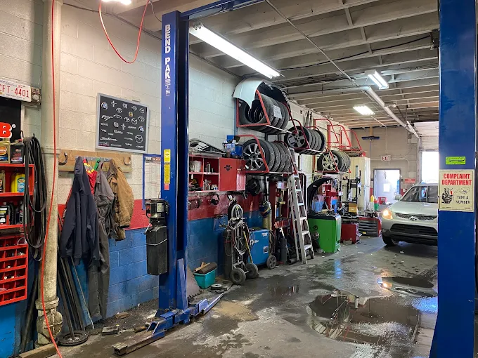 Rite-Price service bay with vehicles being worked on